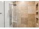 Modern shower featuring stone tiles and spa-like fixtures at 2511 W Morrison Ave, Tampa, FL 33629