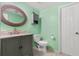 Charming bathroom with green walls, granite countertop and modern fixtures at 2646 61St N Ave, St Petersburg, FL 33714