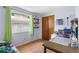 Cozy bedroom with wood floors, natural light, and custom shelves at 2646 61St N Ave, St Petersburg, FL 33714