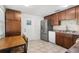 Well-lit kitchen with wooden cabinets, stainless steel appliances, and a cozy breakfast nook at 2646 61St N Ave, St Petersburg, FL 33714