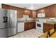 Well-equipped kitchen features stainless steel refrigerator, granite countertops and white appliances at 2646 61St N Ave, St Petersburg, FL 33714