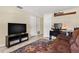 Relaxing living room with a large TV, a comfortable sofa, and a stylish, patterned rug at 2646 61St N Ave, St Petersburg, FL 33714