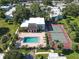 Community amenities include a pool, clubhouse, and tennis court amid lush landscaping and ample shade trees at 2820 Somerset Park Dr # 101, Tampa, FL 33613