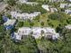 Aerial view of the complex highlighting its buildings, landscaping, parking, and nearby pool area at 2820 Somerset Park Dr # 101, Tampa, FL 33613