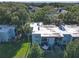 Aerial view of the building showcasing the building's pool, patios, balconies, and lush surroundings at 2820 Somerset Park Dr # 101, Tampa, FL 33613