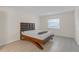 Bedroom with a modern bed frame and tile floors at 2820 Somerset Park Dr # 101, Tampa, FL 33613
