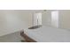Bright bedroom featuring tile floors, walk-in closet, and modern furnishings at 2820 Somerset Park Dr # 101, Tampa, FL 33613