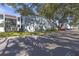 Exterior view of a multi-story building with well-maintained landscaping, and ample parking at 2820 Somerset Park Dr # 101, Tampa, FL 33613
