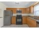 Bright kitchen features stainless steel appliances, tile floors, and granite countertops at 2820 Somerset Park Dr # 101, Tampa, FL 33613