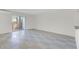 Living room with sliding glass door to balcony and tile flooring at 2820 Somerset Park Dr # 101, Tampa, FL 33613