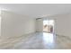 Living room with sliding glass door to balcony and tile flooring at 2820 Somerset Park Dr # 101, Tampa, FL 33613