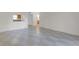 Open-concept living room view to the kitchen and hall at 2820 Somerset Park Dr # 101, Tampa, FL 33613