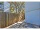 Private patio with stone flooring, and a quaint wooden fence at 2820 Somerset Park Dr # 101, Tampa, FL 33613