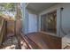 Private patio with a sliding glass door, white door, and a charming wooden fence at 2820 Somerset Park Dr # 101, Tampa, FL 33613