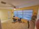 Bright breakfast nook featuring a round table, three chairs, and large windows offering plenty of natural light at 2850 59Th S St # 310, Gulfport, FL 33707