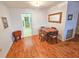 Bright dining room featuring wood-look flooring, neutral paint, adjacent to kitchen at 2850 59Th S St # 310, Gulfport, FL 33707