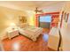 Warm, inviting main bedroom with stylish built-ins, hard wood floors and bedside tables with soft lighting at 2850 59Th S St # 310, Gulfport, FL 33707