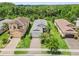 Bird's eye view of a single-story home with a gray roof, nestled in a residential area at 30410 Ceasar Park Dr, Wesley Chapel, FL 33543