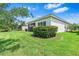 Lush backyard featuring mature trees and partial home view at 30410 Ceasar Park Dr, Wesley Chapel, FL 33543