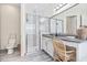 Bright bathroom with shower, granite countertops, and white cabinets at 30410 Ceasar Park Dr, Wesley Chapel, FL 33543