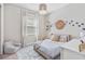 bedroom featuring a charming decor, playful accents, and comfortable design at 30410 Ceasar Park Dr, Wesley Chapel, FL 33543