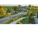 Community entrance with lush landscaping, water features, and a grand gated entry at 30410 Ceasar Park Dr, Wesley Chapel, FL 33543