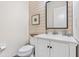 Charming powder room with shiplap accent wall and white vanity at 30410 Ceasar Park Dr, Wesley Chapel, FL 33543