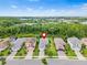 Charming street view of single-Gathering homes with manicured lawns and mature trees at 30410 Ceasar Park Dr, Wesley Chapel, FL 33543