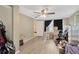 Bright bedroom featuring wood-look floors and natural light from large windows at 3547 Odom Dr, New Port Richey, FL 34652