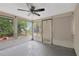 Bonus room offering ample natural light through its windows and a sliding glass door at 3547 Odom Dr, New Port Richey, FL 34652