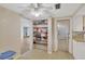 Kitchen with open shelving and doorway to the living room at 3547 Odom Dr, New Port Richey, FL 34652
