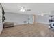 Spacious living room featuring wood-look flooring and abundant natural light at 3547 Odom Dr, New Port Richey, FL 34652