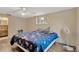 Bedroom with vinyl flooring, ceiling fan, and plenty of natural light at 3547 Odom Dr, New Port Richey, FL 34652