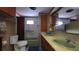 Bathroom featuring double sinks, cabinets, and a bathtub with shower at 37229 Lois Ave, Zephyrhills, FL 33542