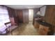 Cozy bedroom space featuring paneled walls and traditional furnishings at 37229 Lois Ave, Zephyrhills, FL 33542