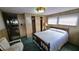 Bright bedroom featuring a comfortable bed and closet space at 37229 Lois Ave, Zephyrhills, FL 33542