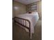 Modest bedroom with simple furnishings and paneled walls at 37229 Lois Ave, Zephyrhills, FL 33542