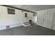 Covered carport area featuring neutral color and door to house at 37229 Lois Ave, Zephyrhills, FL 33542