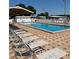A community pool features many lounge chairs to relax near the water at 37229 Lois Ave, Zephyrhills, FL 33542