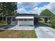 Charming single-story home featuring a carport and well-maintained yard at 37229 Lois Ave, Zephyrhills, FL 33542