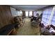 Comfortable living room with patterned sofa and plush seating at 37229 Lois Ave, Zephyrhills, FL 33542