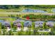 Aerial view showcasing the home's location with nearby ponds, landscaping, and well-maintained neighborhood at 3972 Wisdom Trl, Land O Lakes, FL 34638