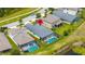 Aerial view highlighting the backyard pool, screened enclosure, and proximity to scenic pond at 3972 Wisdom Trl, Land O Lakes, FL 34638