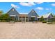 Inviting community clubhouse with benches, manicured landscaping and ample parking at 3972 Wisdom Trl, Land O Lakes, FL 34638