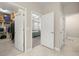 Hallway showing entrances to the primary bedroom, bathroom, and walk-in closet at 3972 Wisdom Trl, Land O Lakes, FL 34638