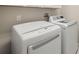 Well-equipped laundry area features a modern washer and dryer for convenience at 3972 Wisdom Trl, Land O Lakes, FL 34638