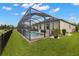 The screened-in pool and patio area is a perfect spot for outdoor entertainment and relaxation at 3972 Wisdom Trl, Land O Lakes, FL 34638