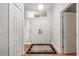 Bright foyer features a double door entrance, wood floors, and a transom window at 423 Fan Palm Ne Ct, St Petersburg, FL 33703