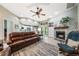 Inviting living room features a fireplace, comfortable seating, and seamless flow into the open-concept kitchen at 423 Fan Palm Ne Ct, St Petersburg, FL 33703