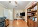 This room features hardwood floors, a built-in bookcase and French doors at 423 Fan Palm Ne Ct, St Petersburg, FL 33703